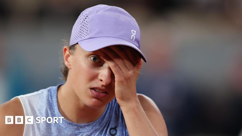 Iga Swiatek reacts during her French Open semi-final defeat by Aryna Sabalenka