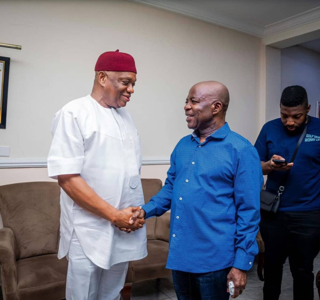 Senator Orji Uzor Kalu (L) shakes hands with Abia Governor Alex Otti (R)