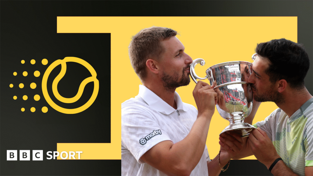 Lloyd Glasspool and Julian Cash kiss the Queen's trophy