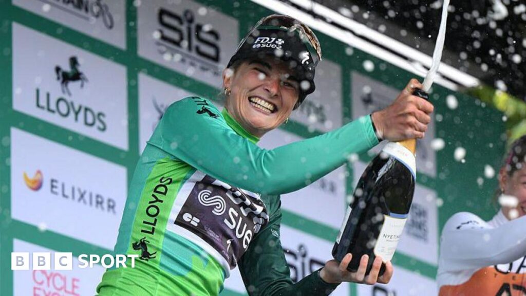 Ally Wollaston celebrates on the podium