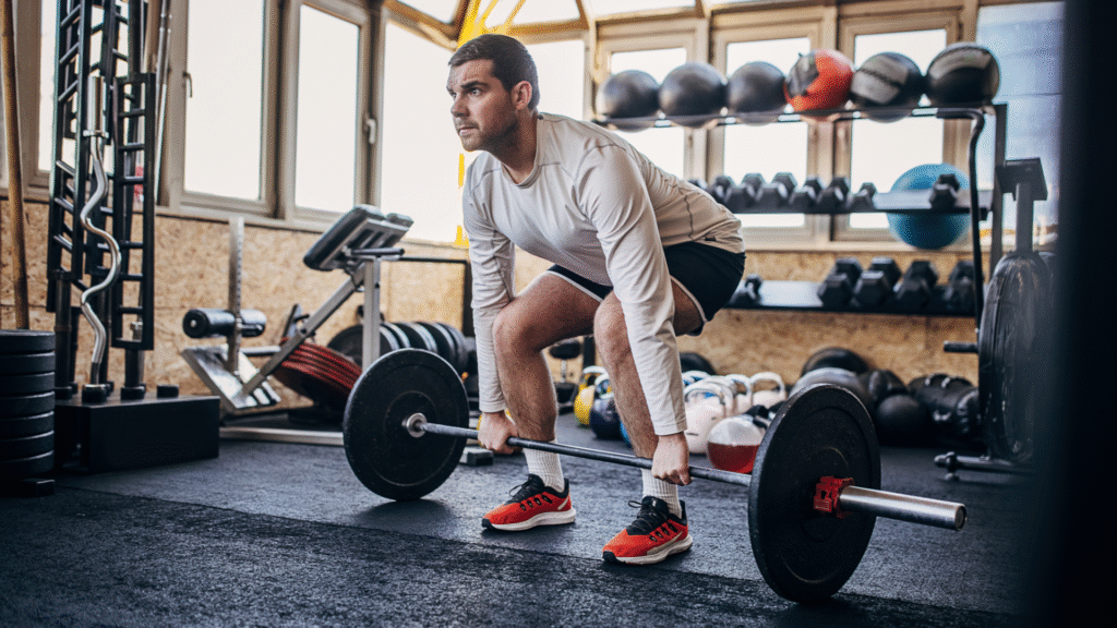 A man performing a deadlift at the gym