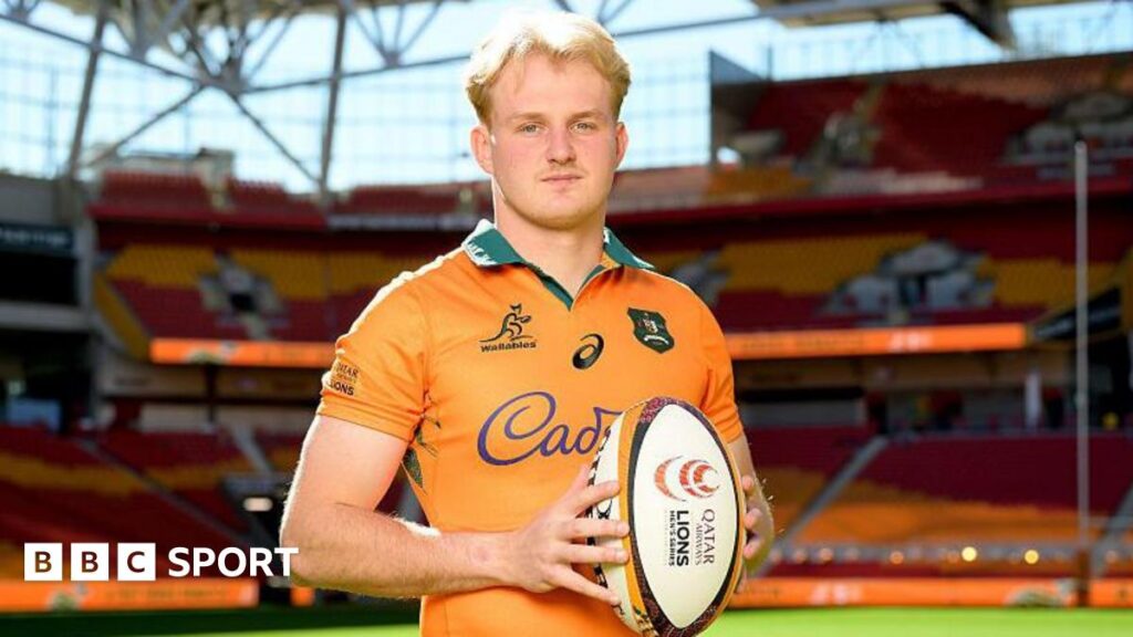 Tom Lynagh poses with a rugby ball