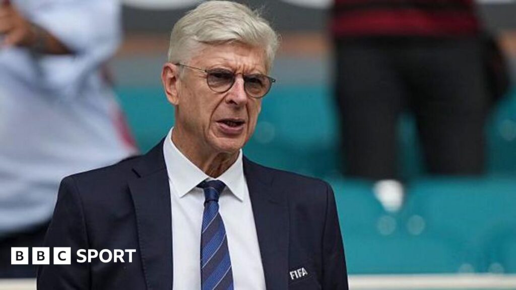 Arsene Wenger wearing a Fifa blazer