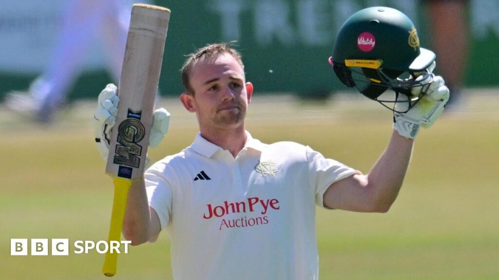 Jack Haynes raises his bat and helmet