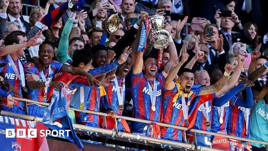 Crystal Palace players lift the FA Cup trophy at Wembley