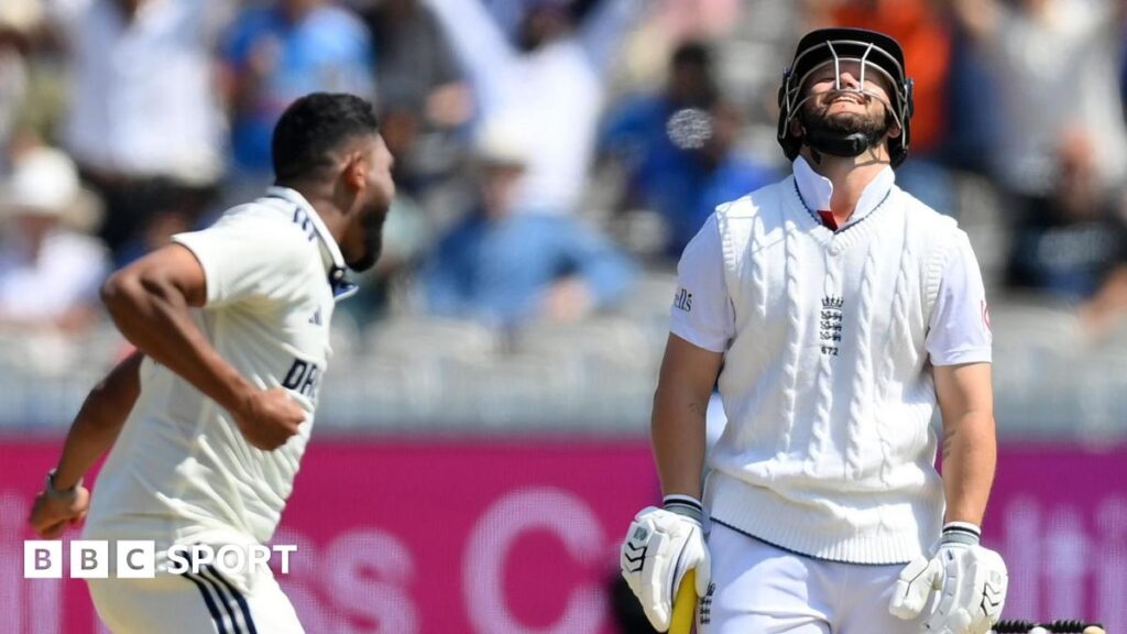 England captain Ben Stokes (left) points to his head as he gestures to India's Akash Deep (right)