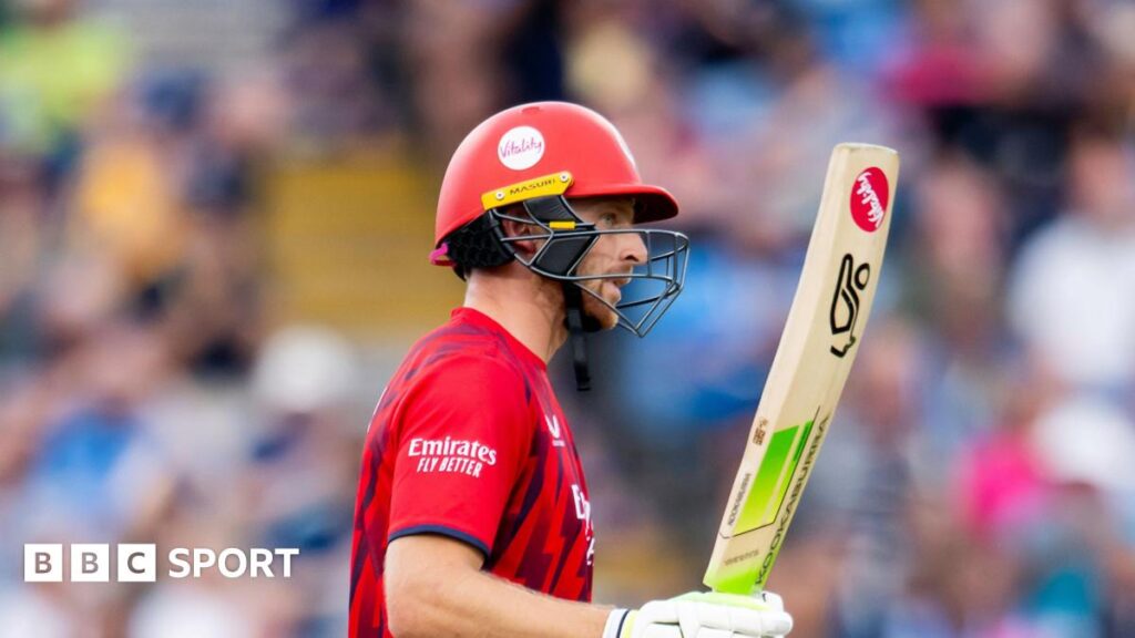 Jos Buttler raises his bat to acknowledge his 50 for Lancashire against Yorkshire at Headingley