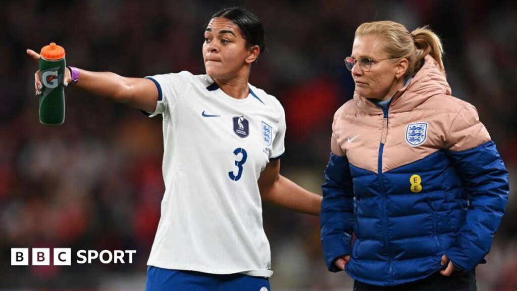 Sarina Wiegman and Jess Carter on the touchline