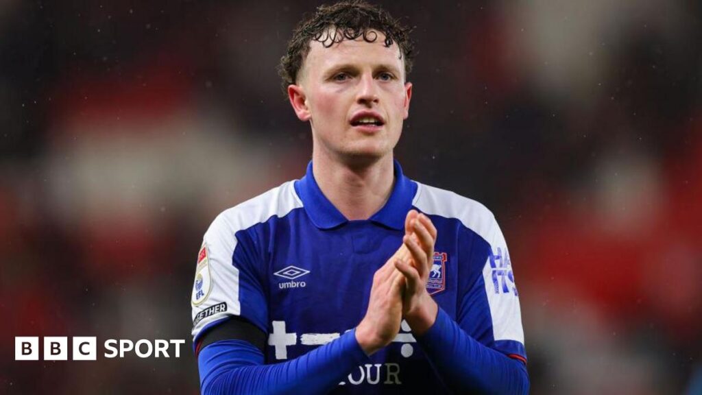 Ipswich Town striker Nathan Broadhead applauds fans