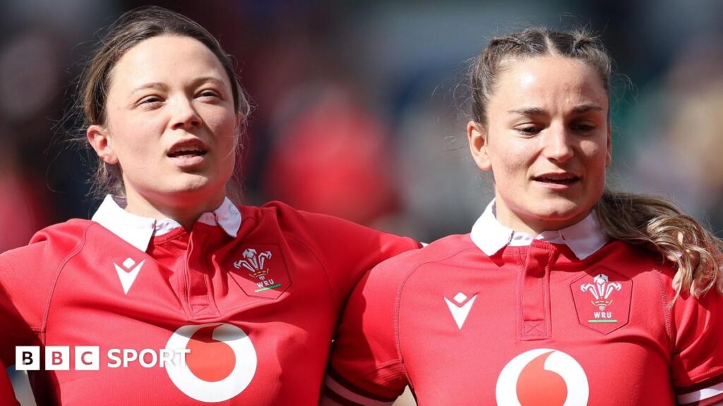 Alisha Joyce-Butchers and Jasmine Joyce-Butchers sing the national anthem side by side before a Wales game