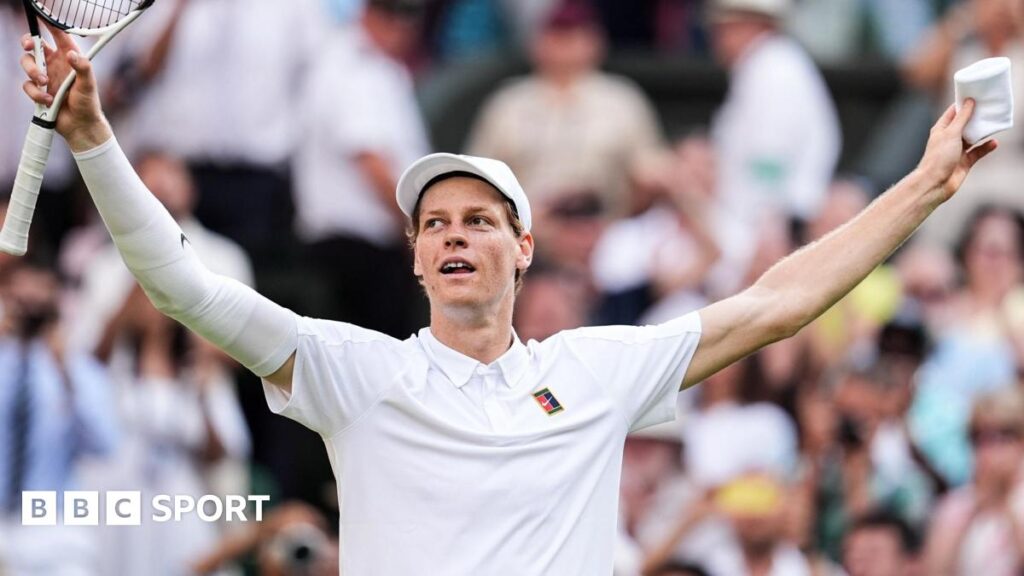 Jannik Sinner crouches to the ground after securing his first Wimbledon title
