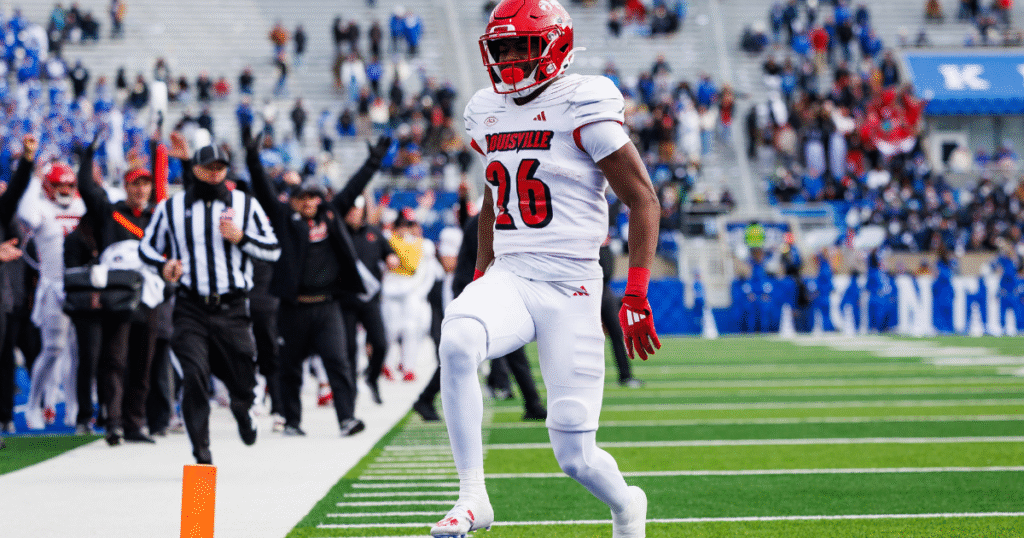 Louisville Duke Watson (26) catches the ball and ran from some yardage against Red Louisville Rodney Johnson (7) in the Spring Game Friday night at L & N Stadium. April 11, 2025