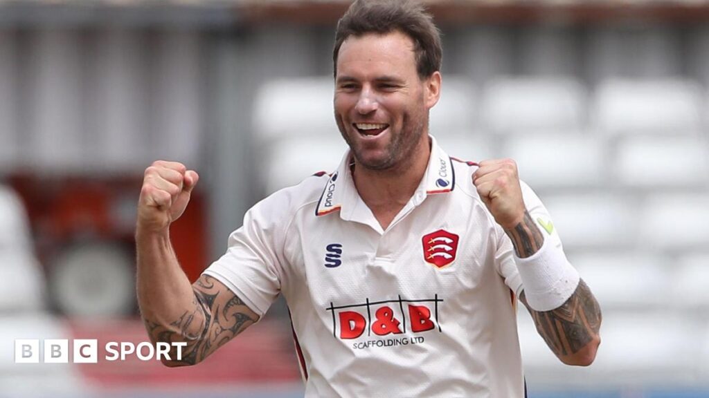 Doug Bracewell raises both fists in celebration after taking a wicket for Essex in 2023
