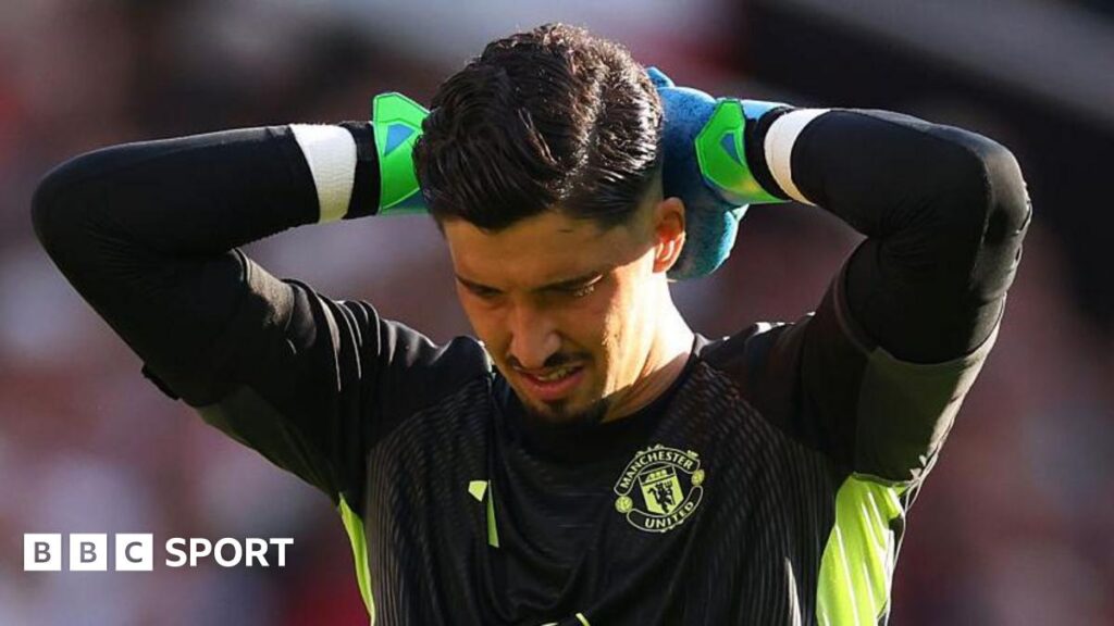 Man Utd goalkeeper Altay Bayindir with his hands on his head