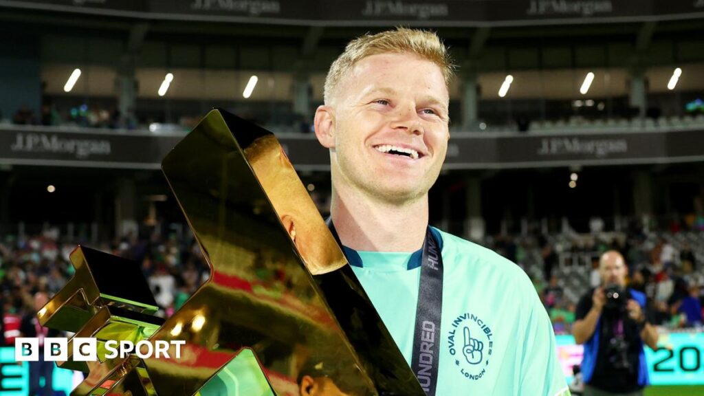 Oval Invincibles captain Sam Billings smiles as he holds up The Hundred 2024 trophy