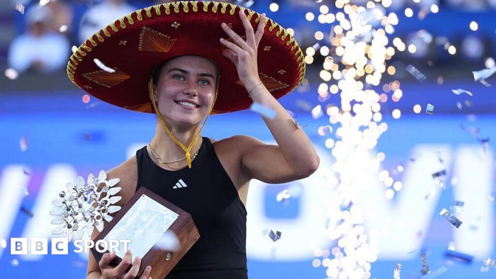 Iva Jovic wears sombrero and holds a trophy after winning the Guadalajara Open