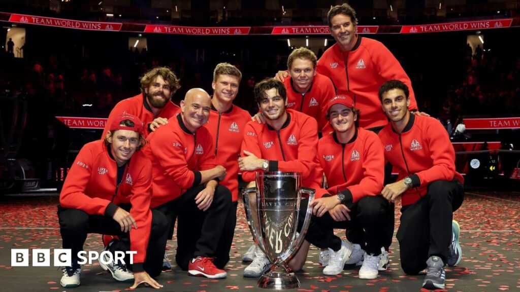 Andre Agassi and his Team World stars pose with the Laver Cup trophy