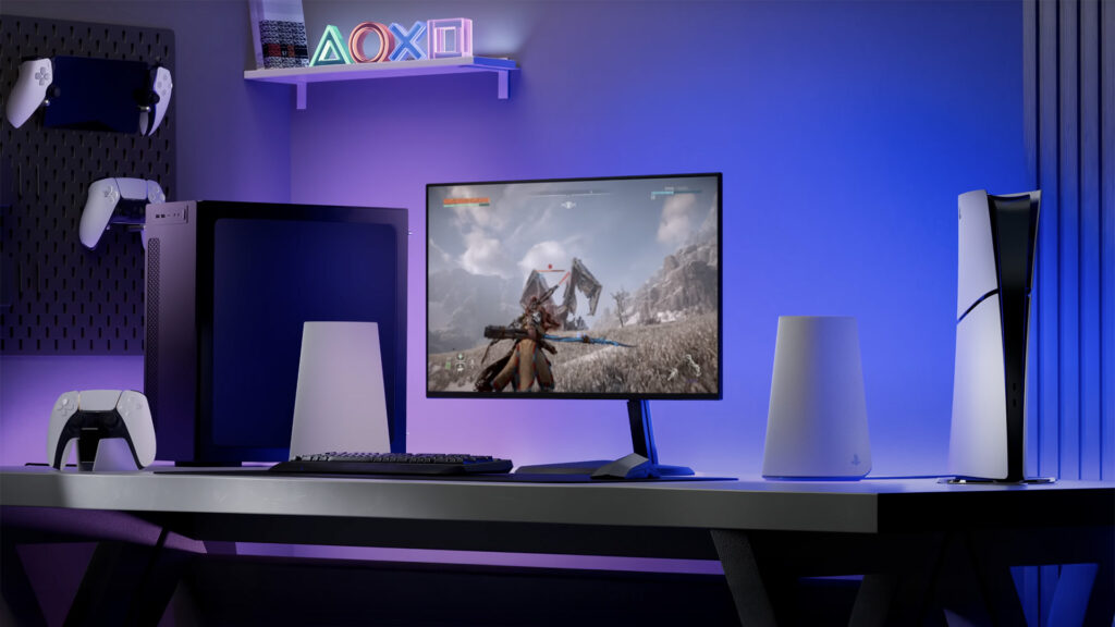 Sony Pulse Elevate speakers in white on a PC gaming desktop with monitor and PS5