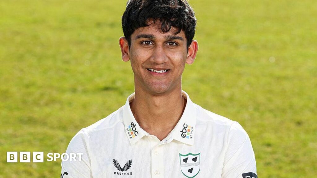Rehaan Edavalath smiles in his white Worcestershire shirt