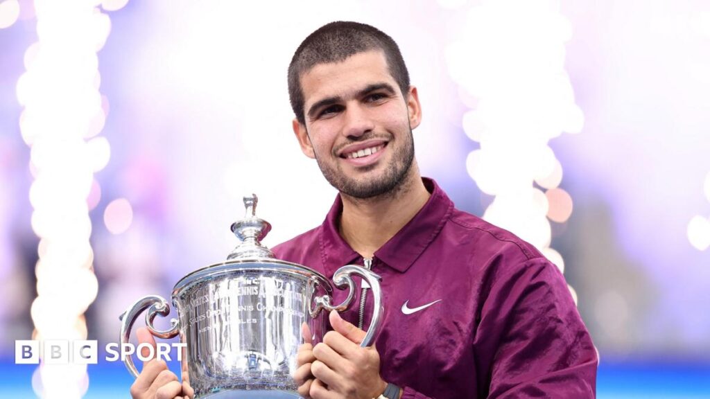 Carlos Alcaraz lifts the US Open trophy