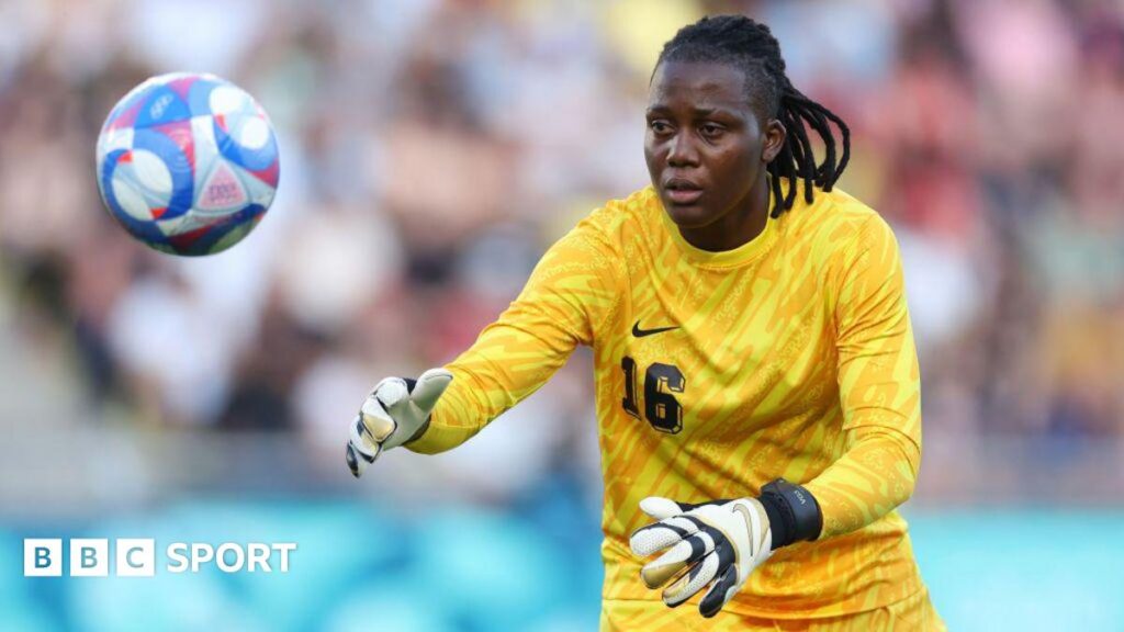 Chiamaka Nnadozie in goalkeeping kit with a football in shot