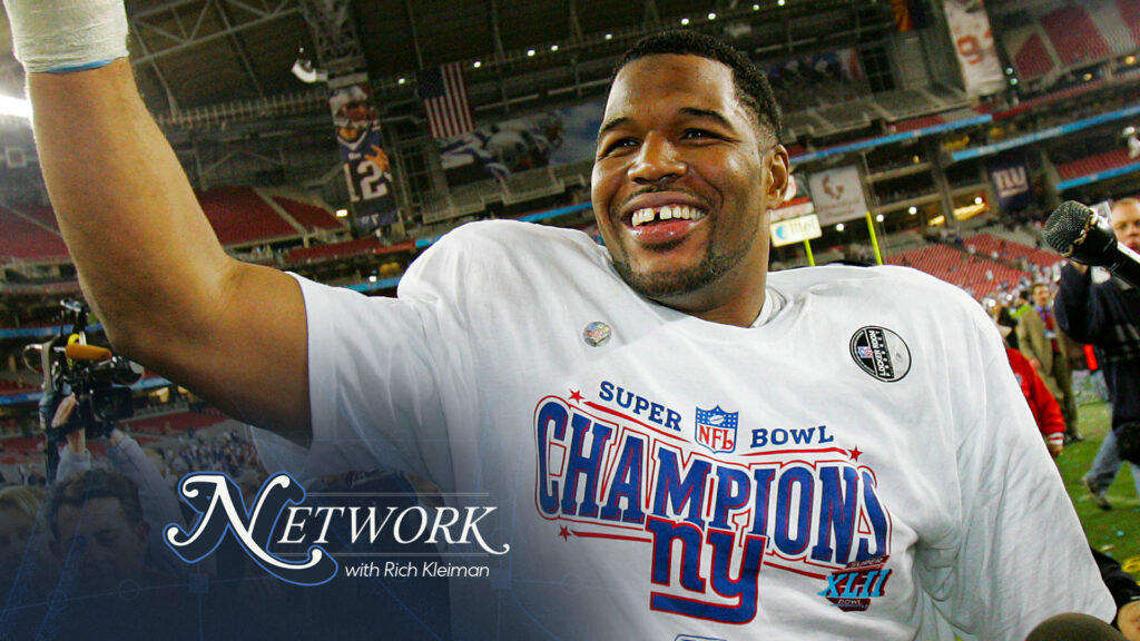 Defensive end Michael Strahan #92 of the New York Giants celebrates after defeating the New England Patriots 17-14 during Super Bowl XLII on February 3, 2008. (Photo by Streeter Lecka/Getty Images)