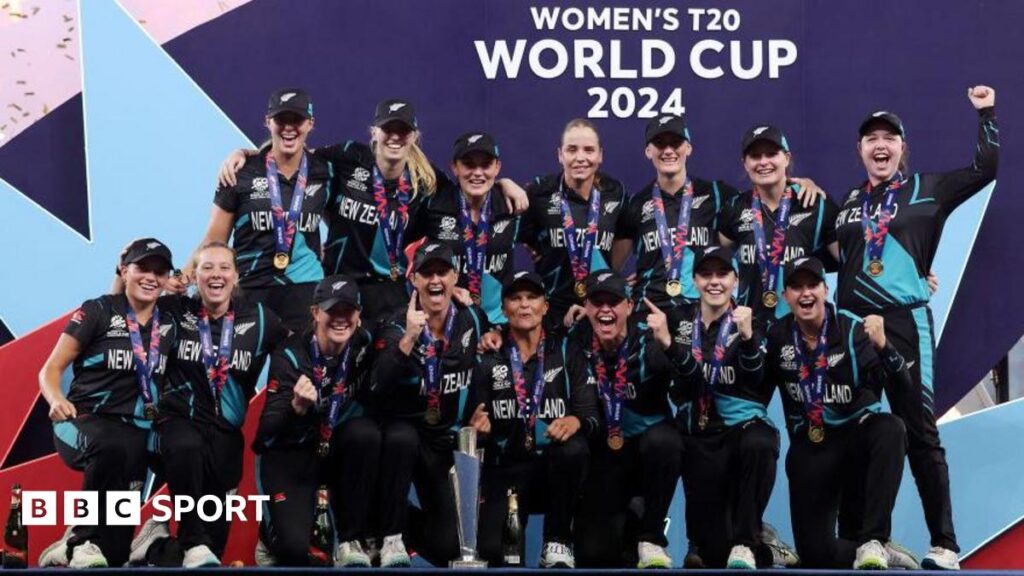 New Zealand's players pose with the T20 World Cup trophy in 2024