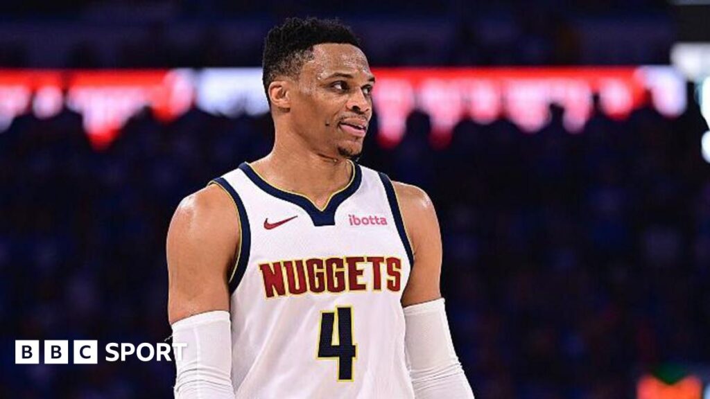 Russell Westbrook looking on in a Denver Nuggets top