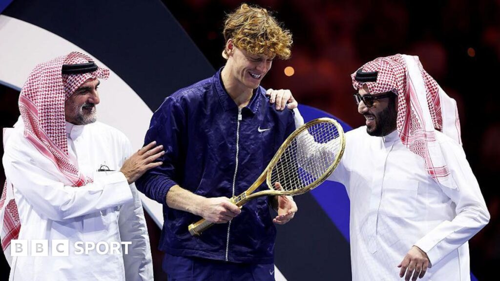Jannik Sinner with Yasir Al-Rumayyan and Turki Al-Sheikh after winning the Six Kings Slam