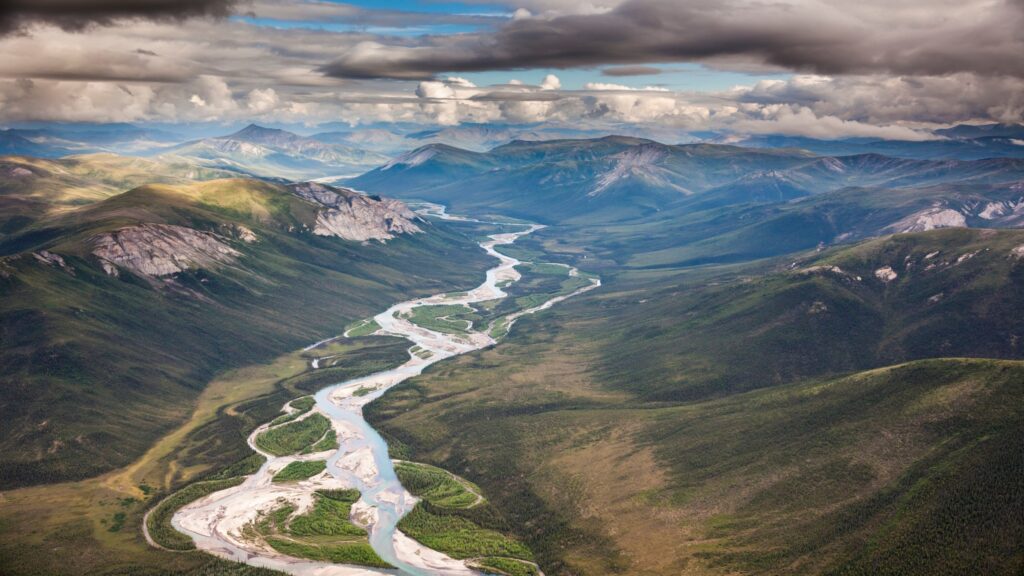 A river flows out of the Brooks Range mountains in Alaska’s Arctic