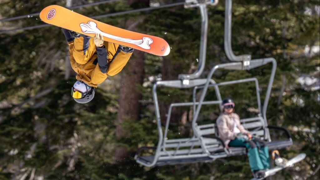 How Outside Tests Snowboards for the Winter Gear Guide Snowboarder flips near chairlift at Kirwood in 2025